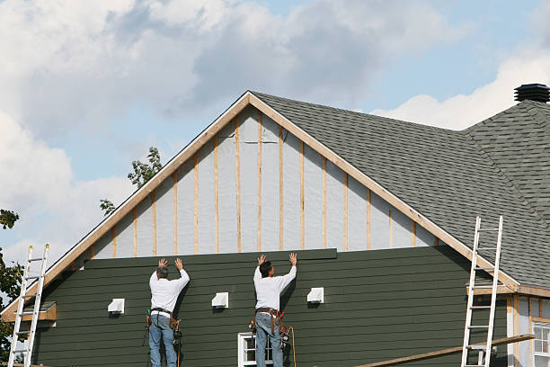 Professional Storm Damage Siding Repair technician working in Martinsburg, PA